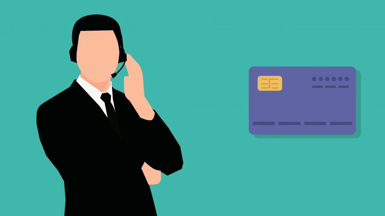 blue bowl of black bean beef tortilla soup on a board with cilantro and shredded cheese in background