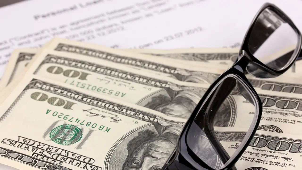 Two mint chocolate milkshakes with whipped cream and green sprinkles.