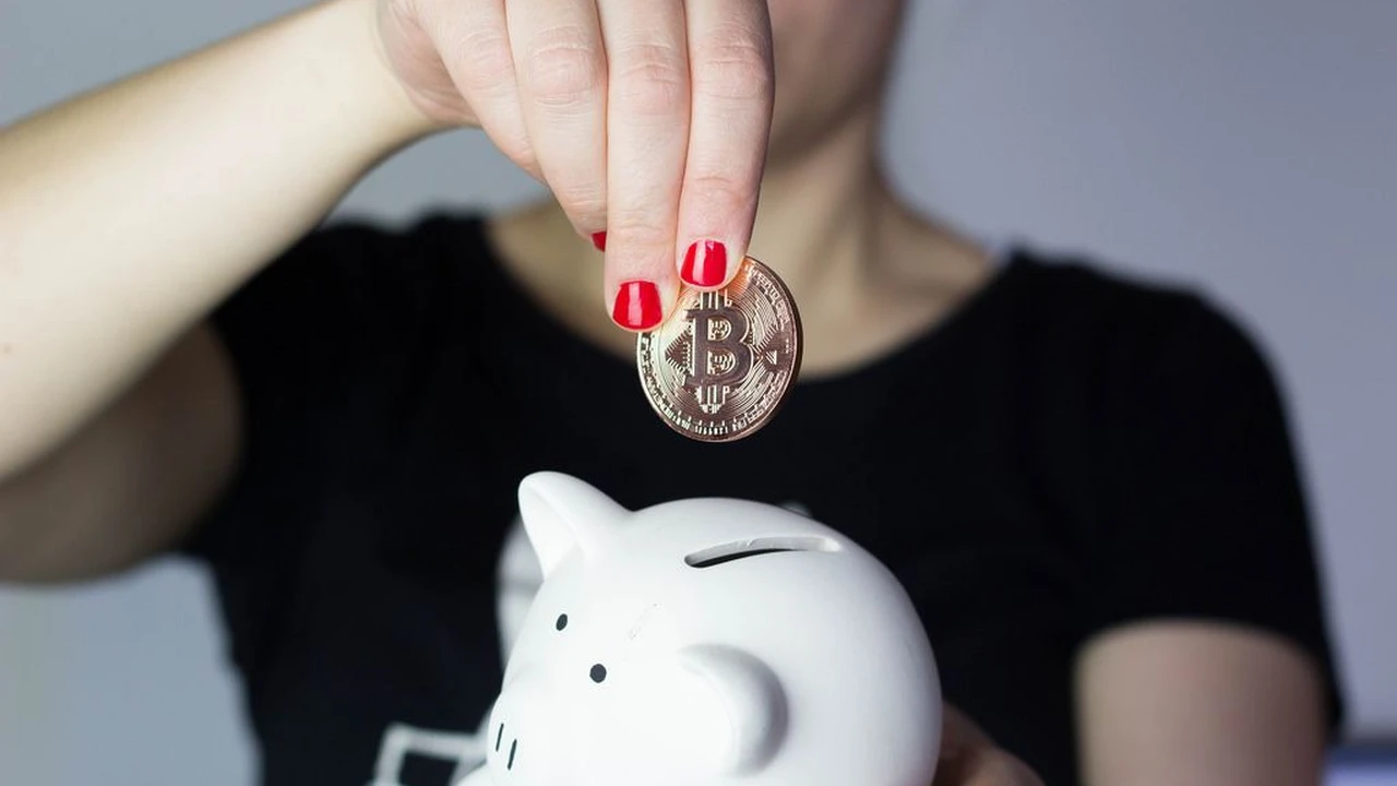Close up on a plate of mashed potatoes, topped with baked pork chops with cream of mushroom soup, and a side of green beans.