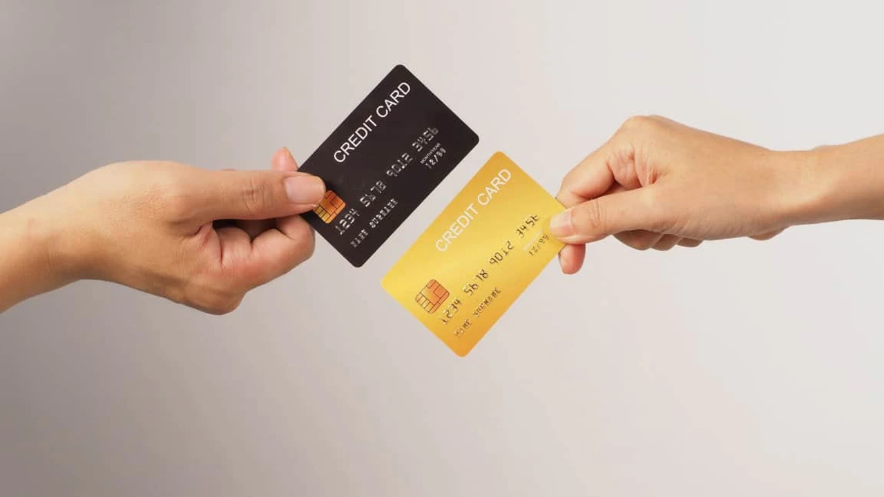 Close up on a plate of mashed potatoes, topped with baked pork chops with cream of mushroom soup, and a side of green beans.